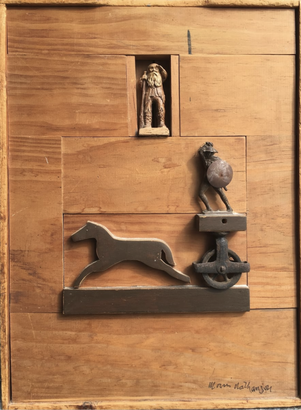 A carved-wood assemblage by Morris Nathanson with a bearded figure, a knight and a running horse